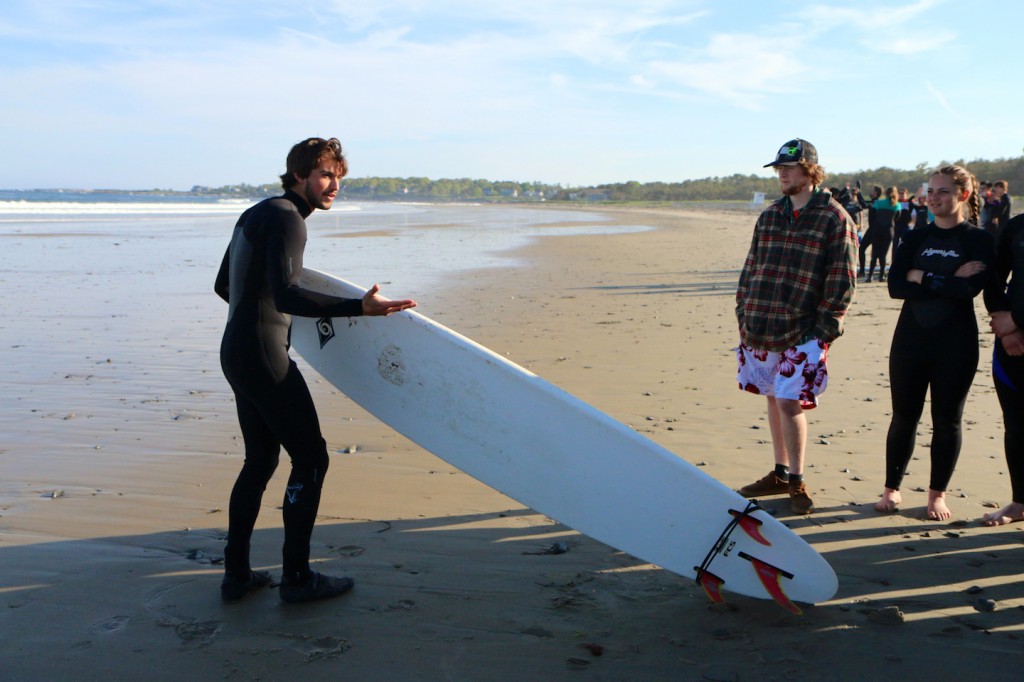 Sawyer teaches a surf lesson