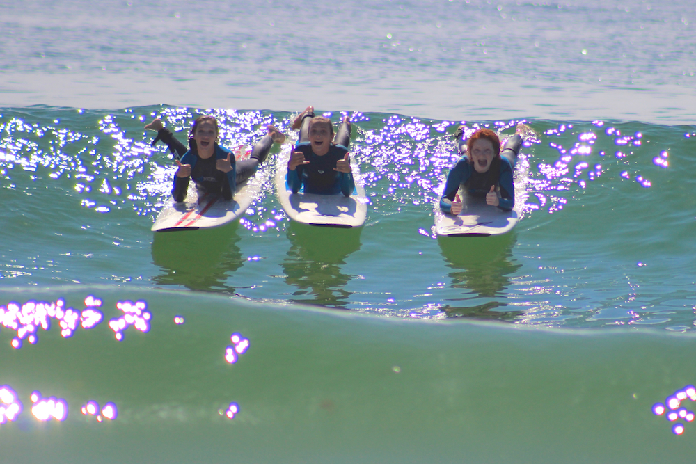 Surf campers enjoying perfect waves and weather